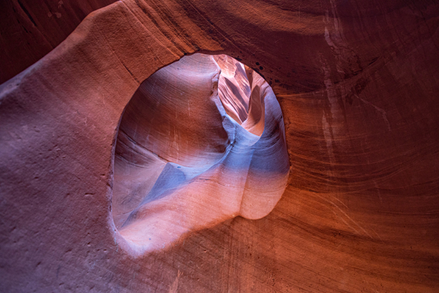 looking through an erosion window from one part of a slot canyon to another