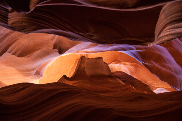 the ceiling of a slot canyon illuminated by reflected light