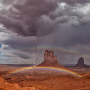 monument valley rainbows under stormy skies