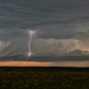 lightning slices through the clouds of a supercell