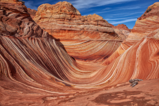 lines of erosion in rock create frozen waves