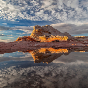 sandstone formation reflected in a still pool